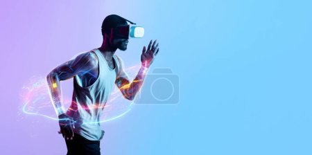 Photo for Sport Techs, Digital Sport. Profile Portrait Of Sporty Black Man Wearing Fitwear Runnin Over Blue Neon Studio Background, Using VR Goggles Headset, Panorama With Copy Space - Royalty Free Image
