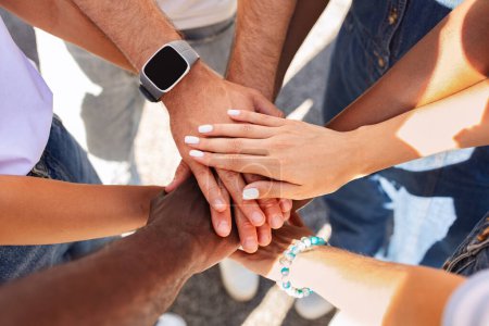 Photo for Top view of stacking hands, cropped. International friendship concept with multiethnic people representing peace and unity against racism. Multiracial love and integration between diversity - Royalty Free Image