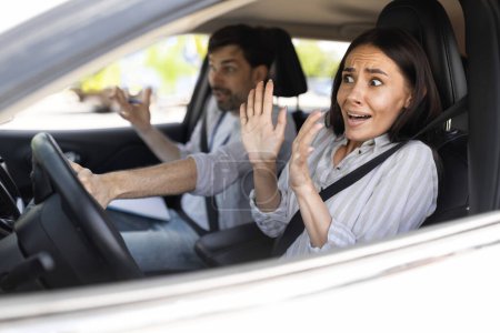 Photo for Driving school, failed driving test. Frightened millennial woman driving car with man instructor. Scared lady student taking hands off steering wheel, looking at road. Fear of driving - Royalty Free Image