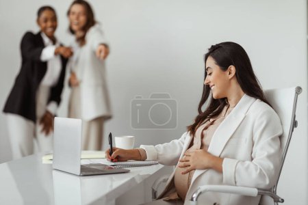 Photo for Colleagues in workplace bullying and pointing at pregnant woman in office, employee victim exclusion or worker harassment and discrimination - Royalty Free Image