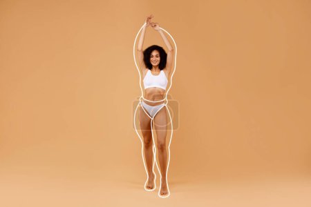 Photo for Sensual black woman posing in white underwear, raising hands up, showing beautiful curves of her body, standing on beige studio background, showing weigh loss results, copy space, full length - Royalty Free Image