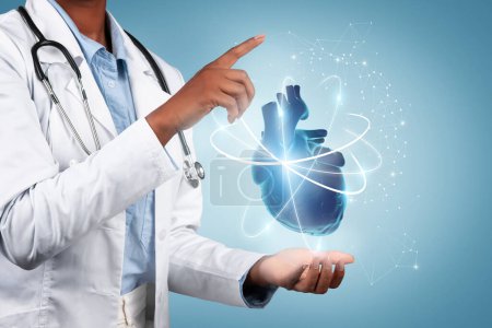 Black woman doctor gently holds realistic heart model in her hand, symbolizing careful, compassionate healthcare, expertise in cardiology, isolated on blue background, studio, cropped, collage