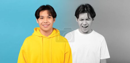 Photo for Happy, despaired and unhappy millennial asian man suffer from depression, cry, on blue and gray background, studio, panorama. Mental problems, stress human emotions and psychology balance - Royalty Free Image