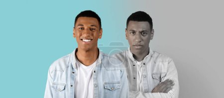 Photo for Smiling, angry, sad millennial african american guy suffer from depression, stress on blue and gray background, panorama, studio. Mental problems, negative emotions, psychological bad mood - Royalty Free Image
