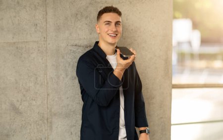 Photo for Positive handsome young european man enjoy lifestyle, calling by smartphone, talk in city, outdoor. Good news work, business, study and conversation at gadget, mobile communication - Royalty Free Image