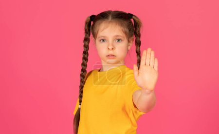 Photo for Refusal Concept. Portrait Of Upset Female Child Showing Stop Gesture At Camera, Preteen Girl Showing Open Palm, Concerned Kid Standing With Outstretched Hand Over Pink Background, Copy Space - Royalty Free Image
