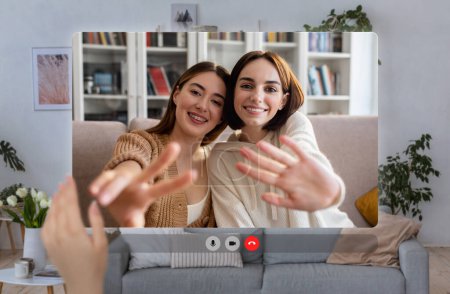 Téléchargez les photos : Pov screen of two happy European young women engaging in friendly video call indoor, waving hands smiling to camera. Digital connection and remote communication concept. Collage - en image libre de droit
