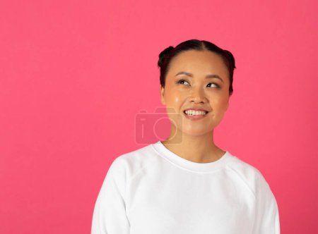 Photo for Portrait Of Interested Young Asian Female Looking Aside With Excitement, Curious Millennial Korean Woman Thinking About Interesting Offer Or News, Standing Isolated Over Pink Background, Copy Space - Royalty Free Image