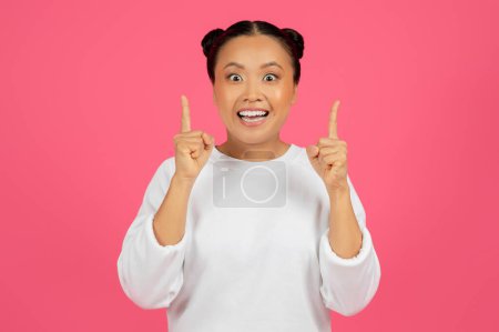 Photo for Excited Young Asian Woman Raising Fingers Up, Having Good Idea, Cheerful Inspired Korean Female Found Solution To Problem, Standing Isolated Over Pink Background And Looking At Camera, Copy Space - Royalty Free Image