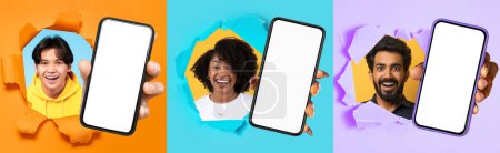 Photo for Three diverse young adults with joyful expressions are creatively showcased popping through colorful paper tears holding blank smartphones, symbolizing connectivity and accessibility - Royalty Free Image