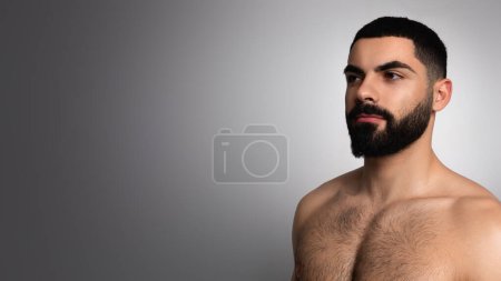 Photo for Tips for men beauty care concept. Handsome sporty naked brunette middle eastern young man looking at copy space, isolated on grey studio background, closeup, panorama - Royalty Free Image