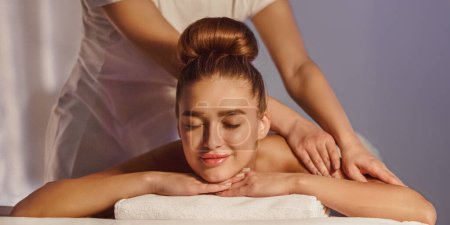 Photo for Total Relaxation. Woman In Spa Salon With Herbal Bags On Foreground, Having Rest - Royalty Free Image