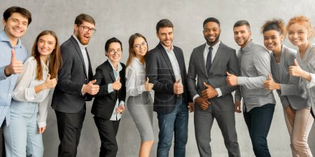 Photo for Cheerful young business team showing thumbs up after conference in office, panorama - Royalty Free Image