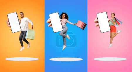 Photo for Big Sales. Happy Multiethnic People Holding Shopping Bags Jumping With Big Blank Smartphones In Hand On Platform Over Colorful Backgrounds, Man And Women Advertising Online Store, Collage, Mockup - Royalty Free Image