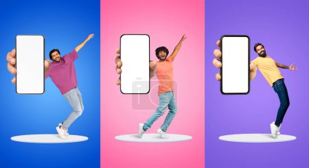 Photo for Happy Multiethnic Guys Dancing With Big Blank Smartphones In Hands, Cheerful Young Men Standing On Round Platform Over Colorful Backgrounds, Recommending New App Or Website, Collage, Mockup - Royalty Free Image