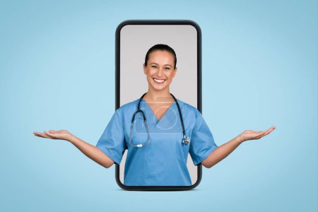 Happy nurse in scrubs framed by smartphone, hands open in welcoming gesture, symbolizing telehealth or online medical consultation, blue background