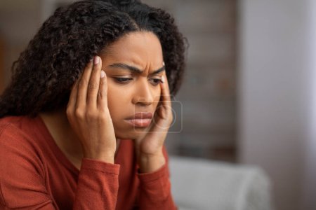 Photo for Headache Concept. Closeup Shot Of Stressed Black Woman Touching Head With Hands, Young African American Female Rubbing Temples, Suffering Severe Migraine While Relaxing At Home, Copy Space - Royalty Free Image