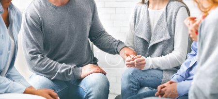 Depressed addicted woman sharing her problems at group meeting of psychological treatment therapy
