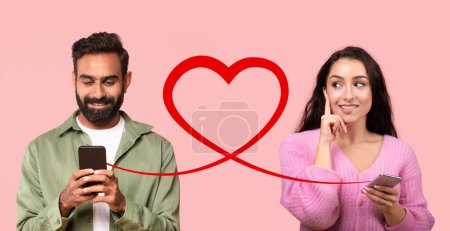 Photo for A man with beard in a green shirt types on phone and thoughtful woman in pink sweater holds hers, connected by heart outline on a pink background, evoking a sense of budding digital romance - Royalty Free Image