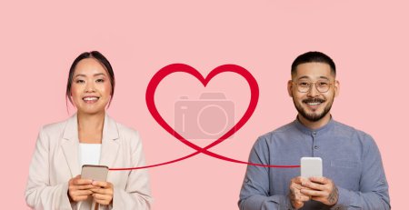 Photo for Two cheerful young adults are holding smartphones with a digitally added red heart connecting their devices on a pastel pink background, symbolizing a connection through technology - Royalty Free Image