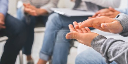 Photo for Closeup of unrecognizable male hands applauding at group therapy session, celebrating common progress, selective focus - Royalty Free Image