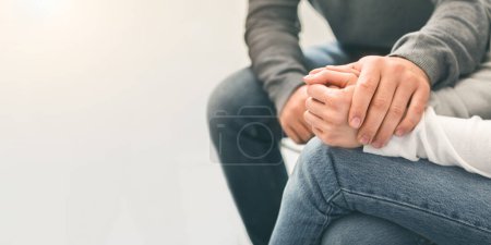 Photo for Comforting of addict. Man counseling desperate woman at group therapy session, panorama, close up - Royalty Free Image