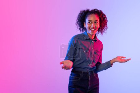 Photo for Welcoming woman with curly hair and open arms, colorful illuminated background - Royalty Free Image