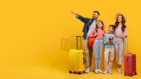 Photo for An excited family with luggage, pointing to something, possibly a travel destination, on a yellow background - Royalty Free Image