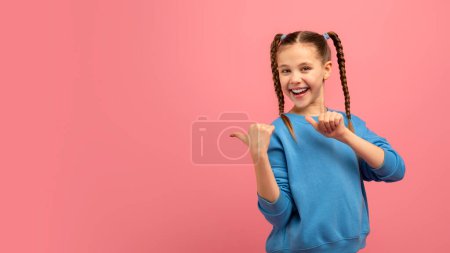 A cheerful girl with braids points to empty space, perfect for advertisements or announcements on pink background