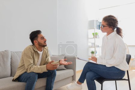 In a therapy session a young man explains his perspective to a therapist, illustrating the dynamic in a marriage