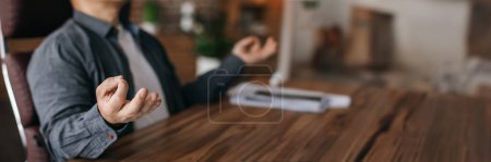Photo for Serious calm man resting in chair at table with laptop in office interior, cropped, blurred, close up. Businessman have relax and take break from work, enjoys meditation and silence, copy space - Royalty Free Image