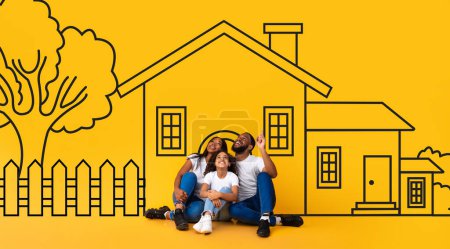 Photo for Dreaming African American family father mother and child sitting on floor over drawn on yellow wall house. Mortgage, real estate concept - Royalty Free Image