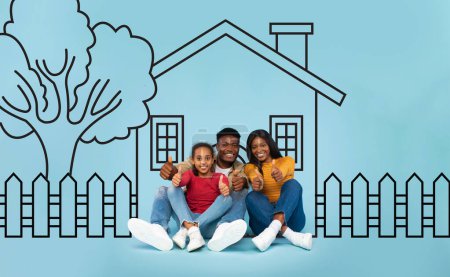 Photo for Positive black family seated on the ground in front of a house. They appear engaged in conversation or a communal activity, creating a sense of community and togetherness. - Royalty Free Image