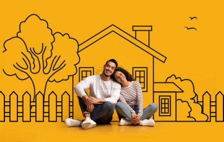 Photo for Cheerful muslim couple sitting on floor with hand-drawn house backdrop behind them, sharing a vision of home, real estate concept - Royalty Free Image