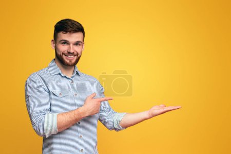 Photo for A man extending his hands outward in a gesture of offering or reaching out, holding them up with palms facing forward. - Royalty Free Image