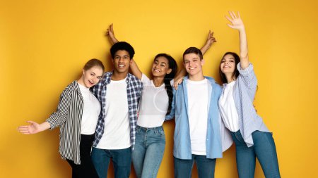 A diverse group of multiethnic teenagers standing close together in a social setting, engaging in conversation and interaction. Men and girls of different ages and ethnicities are seen together in the