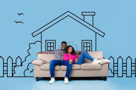 African American man and woman are seated on a couch in front of drawn suburban house on blue background, couple dreaming about home