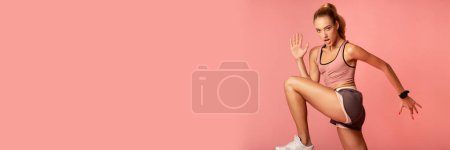 Photo for Fitness And Sport. Motivated Young Woman Jumping Exercising On Pink Background. Studio Shot, Empty Space, Panorama - Royalty Free Image