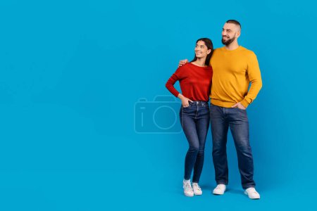 Photo for In the scene, a man and a woman are seen standing side by side, both facing forward. They appear to be close to each other, with no physical contact but showing a sense of closeness, copy space - Royalty Free Image