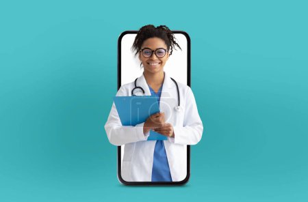 Black young woman doctor provides digital health services, seen inside the blank screen of a smartphone, set against a simple, medical background.