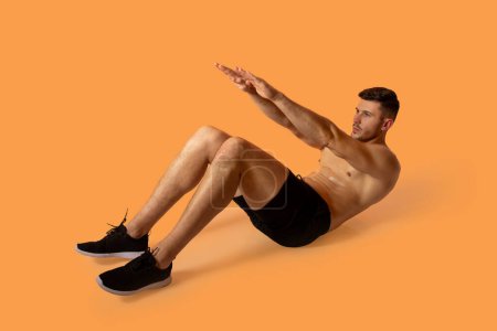 A man is seen doing an exercise against a vibrant orange background. He is focused and engaged in his workout routine, displaying strength and determination.