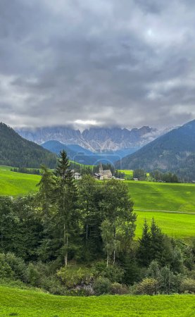 Photo for Santa Maddalena, Val di Funes-Alpine charm, iconic church, meadows, forest trails, Tirolean allure-start your panoramic journey in this picturesque haven. - Royalty Free Image