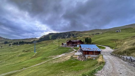 Photo for Fermeda Hut in Seceda: Nestled in the captivating landscape, a cozy refuge amidst Dolomite beauty, a tranquil haven atop South Tyrol's stunning peaks - Royalty Free Image