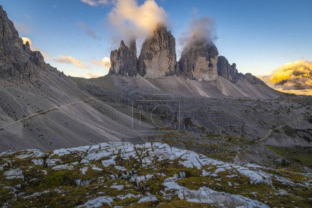 Photo for Autumn sunrise paints a mesmerizing tableau over Tre Cime di Lavaredo in the Dolomites, Italy. Nature's splendor on full display, a tranquil moment captured - Royalty Free Image