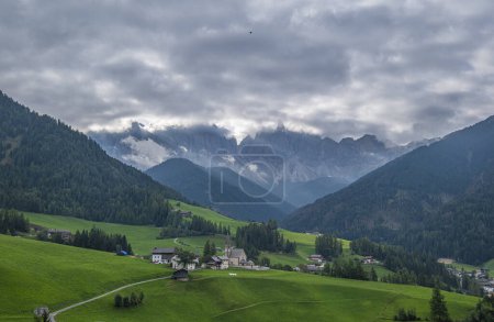 Photo for Santa Maddalena, Val di Funes,Alpine village, iconic church, meadows, forest trails, and Tyrolean charm create a picturesque scene with breathtaking scenery - Royalty Free Image