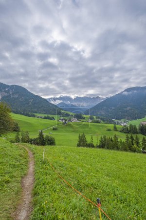 Photo for Santa Maddalena, Val di Funes, Alpine village, iconic church, meadows, forest trails, and Tyrolean charm showcase stunning scenery in this picturesque locale - Royalty Free Image