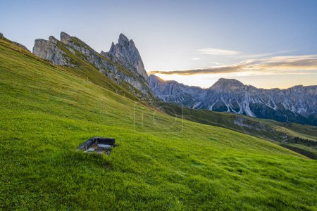 Photo for Seceda at sunrise, Golden hues paint the meadows, creating a breathtaking spectacle in the heart of the Dolomites, a serene and radiant morning scene. - Royalty Free Image