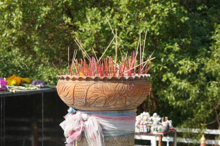 Photo for Clay pots with many incense sticks to worship the Buddha - Royalty Free Image