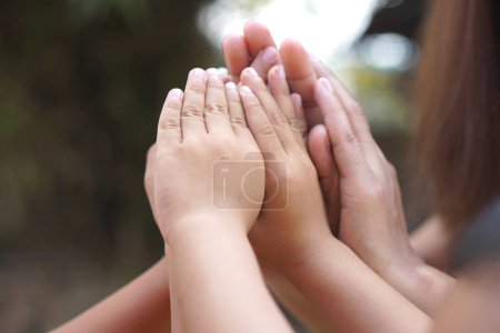 Photo for The hands of a child and a mother join forces. - Royalty Free Image