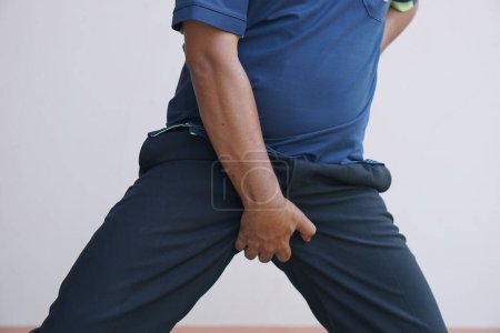 Photo for Asian man having itchy testicles - Royalty Free Image